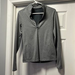 Medium, form fitting, Nike quarter zip.